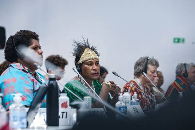 November 11, 2025, Belem, Brazil, Brazil: A delegate from Papua New Guinea, wearing a traditional headdress, listens during a session on Indigenous and tribal representation at COP30. The 2025 conference gathers Indigenous, tribal, and local community leaders from across regions, with Pacific nations emphasizing their vulnerability to rising sea levels and the urgent need for global action on climate resilience. Belem Brazil - ZUMAo116 20251111_znp_o116_023 Copyright: xBiancaxOterox