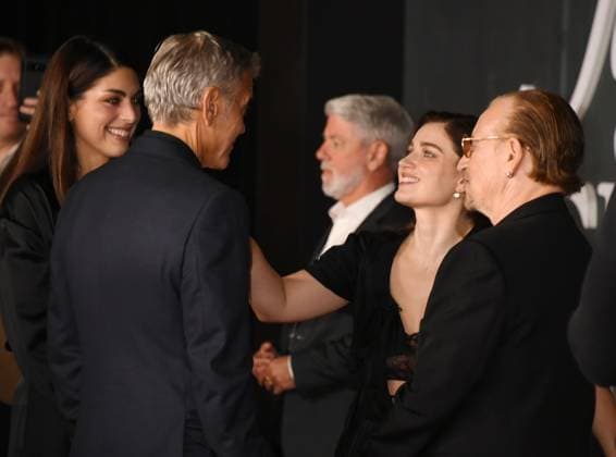 LOS ANGELES, CA- NOVEMBER 11: George Clooney, Eve Hewson and Bono at the Los Angeles premiere of Netflix s Jay Kelly at The Egyptian Theatre Hollywood on November 11, 2025 in Los Angeles, California. Copyright: xJeffreyxMayerx