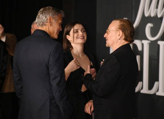 LOS ANGELES, CA- NOVEMBER 11: George Clooney, Eve Hewson and Bono at the Los Angeles premiere of Netflix s Jay Kelly at The Egyptian Theatre Hollywood on November 11, 2025 in Los Angeles, California. Copyright: xJeffreyxMayerx