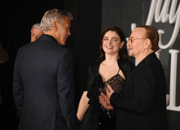 LOS ANGELES, CA- NOVEMBER 11: George Clooney, Eve Hewson and Bono at the Los Angeles premiere of Netflix s Jay Kelly at The Egyptian Theatre Hollywood on November 11, 2025 in Los Angeles, California. Copyright: xJeffreyxMayerx