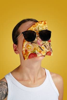 a slice of pizza lies on a face with glasses R_KUAL251110A-1833961-01