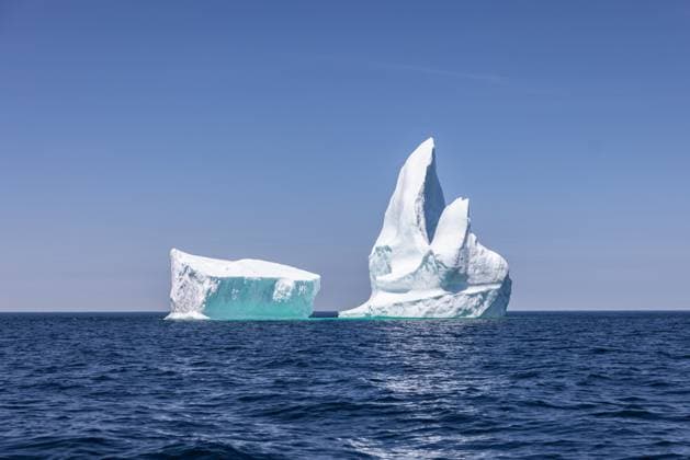 White Iceberg on Wavy Blue Water Bonavista, Newfoundland and Labrador, Canada R_NCJL251110-1893629-01