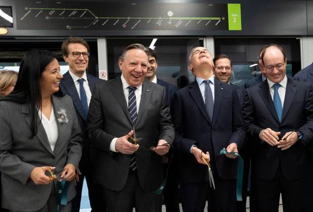 November 14, 2025, Montreal, Pq, CANADA: Prime Minister Mark Carney, second right flanked by from left to right Montreal mayor Soraya Martinez Ferrada, Quebec Premier Francois Legault and CEO of La Caisse Charles Emond reacts as he finally gets his scissors to work to cut the ribbon for the inaugural run connecting McGill station in downtown Montreal to Deux-Montagnes, Quebec in Montreal on Friday, Nov. 14, 2025. Montreal CANADA  - ZUMAc35_ 20251114_zaf_c35_002 Copyright: xChristinnexMuschix
