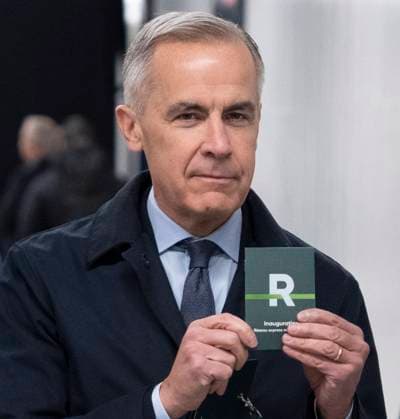 November 14, 2025, Montreal, Pq, CANADA: Prime Minister Mark Carney holds up a REM passport as he arrives to ride the REM light rail system on its inaugural run connecting McGill station in downtown Montreal to Deux-Montagnes, Que., in Montreal, on Friday, Nov. 14, 2025. Montreal CANADA  - ZUMAc35_ 20251114_zaf_c35_019 Copyright: xChristinnexMuschix