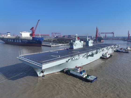 (251114) -- SHANGHAI, Nov. 14, 2025 -- China s first Type 076 amphibious assault ship, PLANS Sichuan, sets sail from the port of Hudong-Zhonghua Shipbuilding (Group) Co., Ltd. in east China s Shanghai, Nov. 14, 2025. PLANS Sichuan set sail from Shanghai on Friday morning to conduct its first navigation test mission. The sea trial will focus on testing and verifying the reliability and stability of the ship s power, electrical and other systems. (Photo by Xinhua) CHINA-SHANGHAI-AMPHIBIOUS ASSAULT SHIP-FIRST SEA TRIAL-LAUNCH (CN) ZhangxLiang 