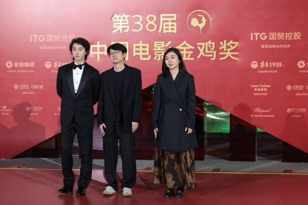 XIAMEN, CHINA - NOVEMBER 15: (L-R) Actor Sun Ning, director Qiu Sheng and producer Li Lingyan of My Father s Son arrive at the red carpet for the closing ceremony during the 38th China Golden Rooster Awards on November 15, 2025 in Xiamen, Fujian Province of China.  Copyright: xVCGx 111604072474
