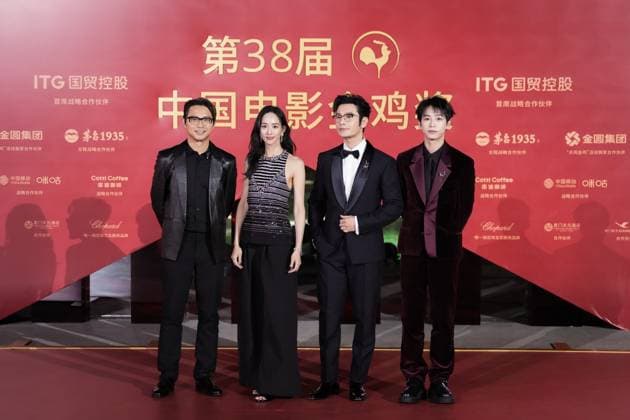 XIAMEN, CHINA - NOVEMBER 15: (L-R) Director Sam Quah, actress Ning Chang, actor Huang Xiaoming and actor Peng Yuchang of The Fire Raven arrive at the red carpet for the closing ceremony during the 38th China Golden Rooster Awards on November 15, 2025 in Xiamen, Fujian Province of China.  Copyright: xVCGx 111604093524