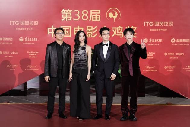 XIAMEN, CHINA - NOVEMBER 15: (L-R) Director Sam Quah, actress Ning Chang, actor Huang Xiaoming and actor Peng Yuchang of The Fire Raven arrive at the red carpet for the closing ceremony during the 38th China Golden Rooster Awards on November 15, 2025 in Xiamen, Fujian Province of China.  Copyright: xVCGx 111604093568