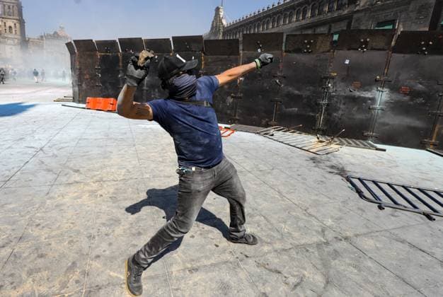 Gen Z Protest Against Mexico s Government A person throws a stone during ˜Gen Z™ demonstration at main square Zocalo against the Mexican government following the murder of Uruapan Mayor Carlos Manzola, while Mexico s President, Claudia Sheinbaum, has questioned the legitimacy of the movement in recent days . on November 15, 2025 in Mexico City, Mexico. (Photo by Ian Robles Eyepix Group) Copyright: xIanxRoblesx xEyepixxGroupx EL_15112025_173161JPEG