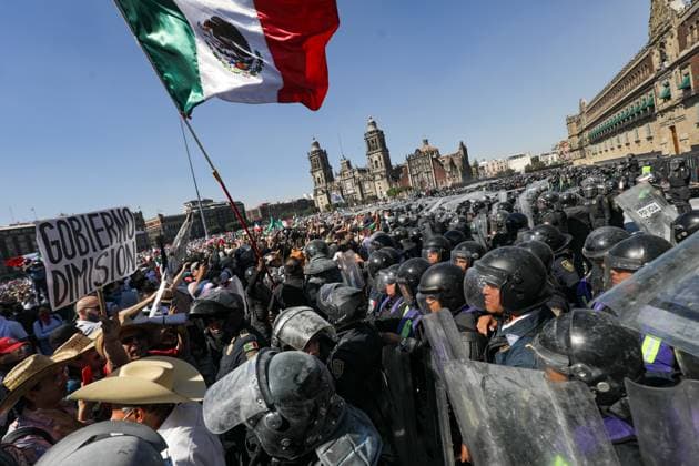 People confront riot police during the Ã¢â‚¬ËœGen ZÃ¢â‚¬â ¢ demonstration at main square Zocalo against the Mexican government following the murder of Uruapan Mayor Carlos Manzola, while Mexico s President, Claudia Sheinbaum, has questioned the legitimacy of the movement in recent days . on November 15, 2025 in Mexico City, Mexico. Mexico City Mexico - ZUMAe321 20251115_zia_e321_051 Copyright: xIanxRoblesx