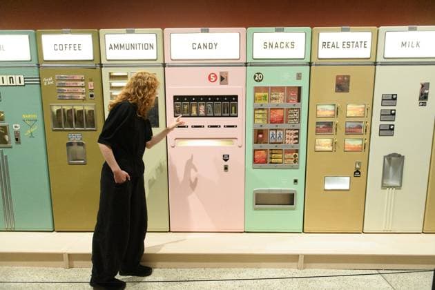 Wes Anderson: The Archives Press Preview at Design Museum, London, UK A staff member views A bank of Vending Machines created for Asteroid City by Atelier Simon Weisse and Erica Dorn (2021) at a photocall for The Design Museum s Wes Anderson: The Archives Exhibition at The Design Museum in London, England, UK on Monday 17 November 2025. The exhibition runs from 21 November 2025 - 26 July 2026., Credit:Justin Ng Avalon UK, England, London, Design Museum  Copyright: xJustinxNgx xAvalonx 1052941805