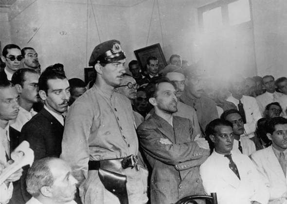 1937, Rio De Janeiro, Brazil: LUIS CARLOS PRESTES, (C) Brazilian Communist Party leader, at the Security Court in 1937 at Special Police Headquarters, Rio De Janeiro. Imprisoned after a violent uprising in 1935 and sentenced to 30 years, he was released after World War II and later served briefly as a senator. Rio De Janeiro Brazil - ZUMA 19720404_baf_k09_081 Copyright: xKeystonexPressxAgencyx