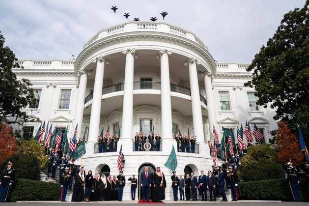 President Donald Trump and Saudi Arabia s Crown Prince Mohammed bin Salman watch as military fighter jets perform a flyover during a welcoming ceremony at the White House in Washington DC on Tuesday, November 18. 2025. The two leaders are expected to discuss defense, nuclear power, technology, and Israel during the visit.  WAX20251118843 NATHANxHOWARD