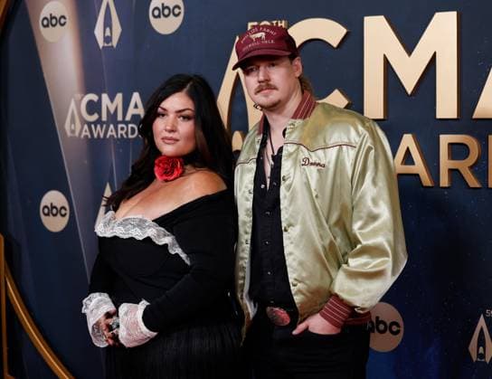 (L-R) Logan Simmons and Malachi Mills arrive on the red carpet for the 59th CMA Awards in Nashville, Tennessee, on Wednesday, November 19, 2025.  NAS20251119140 JOHNxANGELILLO