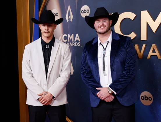 (L-R) John Park and Wales Toney arrive on the red carpet for the 59th CMA Awards in Nashville, Tennessee, on Wednesday, November 19, 2025.  NAS20251119163 JOHNxANGELILLO