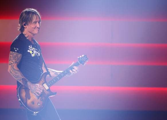 Keith Urban performs onstage during the 59th CMA Awards at the Bridgestone Arena in Nashville, Tennessee, on Wednesday, November 19, 2025.  NAS20251119289 JOHNxANGELILLO