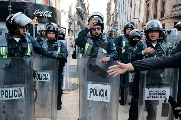 November 20, 2025, Mexico, Cdmx, Mexico: Around 100 Gen Z demonstrators marched down Paseo de la Reforma to protest insecurity, corruption, and drug trafficking. Riot police twice blocked their path due to the Mexican Revolution military parade, detaining them briefly before allowing the march toward Mexico City™s main square. The protest remained peaceful, with Black Bloc members again carrying a One Piece flag. Mexico Mexico - ZUMAp204 20251120_zip_p204_022 Copyright: xJosuexPerezx
