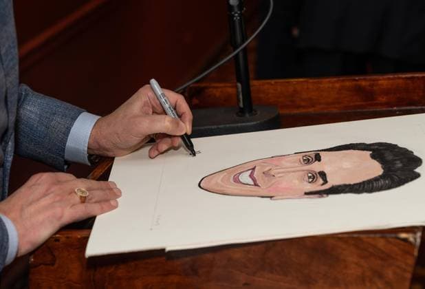 November 21, 2025, Bronx, New York, USA: Nick Scandalios, Executive Vice President of Nederlander Organization owner of many theaters on Broadway autographs his portrait during unveiling at Sardi s in New York, NY on November 21, 2025 Bronx USA - ZUMAr339 20251121_znp_r339_006 Copyright: xLevxRadinx