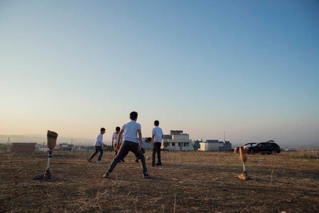 Iraqi Deminer Loses Legs Clearing Mines Boys play soccer across a field using Hoshyar Ali s prosthetic legs as goal posts in Halabja, Iraq, on November 20, 2025. Hoshyar Ali has been clearing landmines for over four decades, a task he began after the Iran-Iraq war when thousands of mines were planted along the border. Despite losing both legs and several family members to explosions, he continues to volunteer in mine removal. Locals call him man of the mines,? and he is building a museum in his village to display defused explosives for future generations. Halabja Sulaymaniyah Iraq Copyright: xShowanxSulaimanx