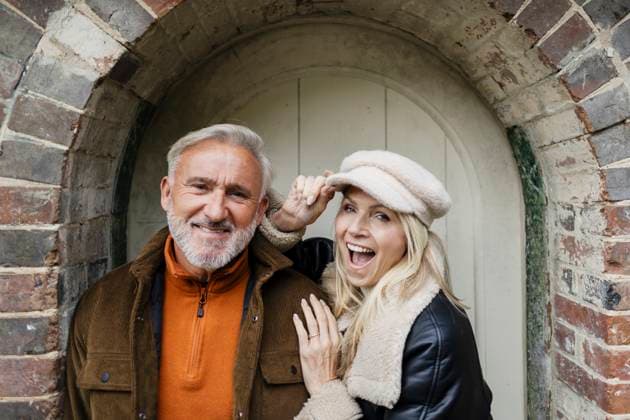 Smiling mature couple outdoors showing playful affection and connection model released, Symbolfoto, ASGF07201