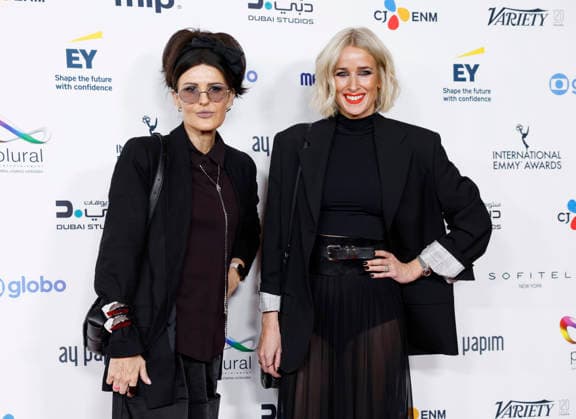 British producers Tania Alexander (L) and Lucy Whelan arrive on the red carpet at the 53rd International Emmy Awards at New York Hilton Midtown in New York City on Monday, November 24, 2025.  NYP20251124221 JohnxAngelillo