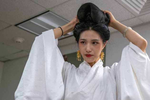 SAN FRANCISCO, CA - NOVEMBER 16: A hanfu enthusiast gets dressed during the annual Hanfu parade organized by Northern California Hanfu Association on November 16, 2025 in San Francisco, California.  Copyright: xVCGx 111605922254