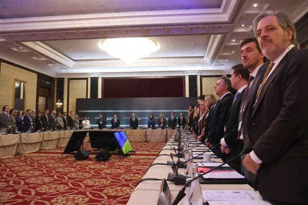 Participants stand to attention during the sounding of the Ukrainian anthem at the start of the Sanctions Summit in Kyiv, Ukraine, November 27, 2025. The summit convenes over 60 sanctions policy officials from the European Union, the United States, and Canada. Discussions focus on critical issues, including the shadow fleet, energy, financial restrictions, sanctions circumvention, and the operations of Russia’s military-industrial complex. (Photo by Pavlo Bahmut Ukrinform) Inaugural Sanctions Summit underway in Kyiv Copyright: xPavloxBahmutx