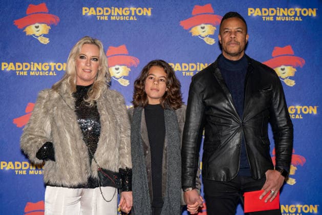 November 30, 2025, London, United Kingdom: L-R Ceri Ann Gregory, guest and Michael Wildman seen arriving on the Blue Carpet during the Paddington The Musical World Premiere opens in the West End, London. London United Kingdom - ZUMAs197 20251130_aaa_s197_563 Copyright: xBonniexBritainx
