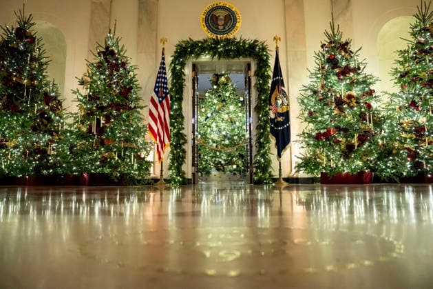 The 2025 White House Christmas Tree is seen through the Cross Hall of the White House during a media preview of the 2025 holiday decorations in Washington, DC on Monday, December 1, 2025. The theme for this year s White House holiday decorations is Home Is Where the Heart is.  WAP20251201327 BONNIExCASH