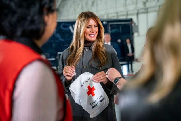 First Lady Melania Trump(C), creates care packages for deployed Service members with volunteers with the American Red Cross, U.S. Government Cabinet spouses, military spouses an Second Lady Usha Vance at Joint Base Andrews in Prince Georges County, Maryland on Monday, December 1, 2025.  WAP20251201335 BONNIExCASH