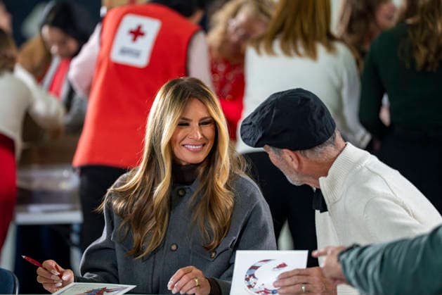 First Lady Melania Trump speaks with a volunteer while creating care packages for deployed Service members with Second Lady Usha Vance, the American Red Cross, U.S. Government Cabinet spouses and military spouses at Joint Base Andrews in Prince Georges County, Maryland on Monday, December 1, 2025.  WAP20251201358 BONNIExCASH