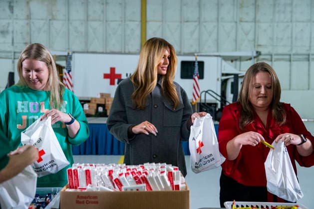 First Lady Melania Trump(C), creates care packages for deployed Service members with volunteers with the American Red Cross, U.S. Government Cabinet spouses, military spouses an Second Lady Usha Vance at Joint Base Andrews in Prince Georges County, Maryland on Monday, December 1, 2025.  WAP20251201367 BONNIExCASH