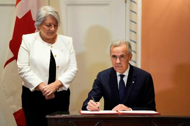 December 1, 2025, Ottawa, On, CAN: Prime Minister Mark Carney participates in a signing as Gov. Gen. Mary Simon looks on, during a cabinet swearing in ceremony at Rideau Hall in Ottawa, on Monday, Dec. 1, 2025. Ottawa CAN  - ZUMAc35_ 20251201_zaf_c35_040 Copyright: xJustinxTangx
