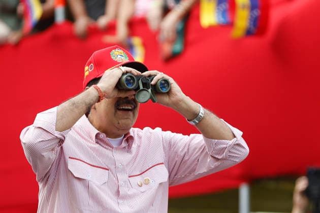 (251202) -- CARACAS, Dec. 2, 2025 -- Venezuelan President Nicolas Maduro attends a rally in Caracas, capital of Venezuela, Dec. 1, 2025. Venezuela does not want a slave s peace, Venezuelan President Nicolas Maduro told supporters Monday as U.S. military deployment has been testing his country for months. We want peace, but peace with sovereignty, peace with equality, peace with freedom; we do not want the peace of slaves or the peace of colonies. A colony never, slaves never, Maduro declared, noting that the 22-week U.S. military aggression can be described as psychological terrorism. (Str Xinhua) VENEZUELA-CARACAS-RALLY-MADURO PedroxMATTEY 