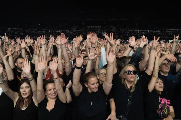 December 2, 2025, Frankfurt, Hesse, Germany: Fans raise their hands during a concert by the Swedish garage rock band The Hives in Frankfurt, Germany. Frankfurt Germany - ZUMAb332 20251202_zip_b332_003 Copyright: xMatiasxBasualdox