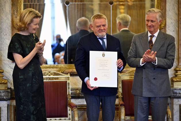 Queen Mathilde of Belgium, Alain Smits of Teinturie de la Senne and King Philippe - Filip of Belgium pose for the photographer during a royal reception with the newly appointed suppliers holding a Royal warrant of appointment (Brevet van Hofleverancier - Brevet de Fournisseurs de la cour), at the Royal Palace, in Brussels, Wednesday 03 December 2025.  ERICxLALMAND 146115285