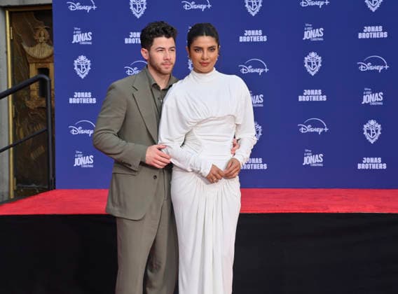 Nick Jonas is joined by his wife Priyanka Chopra at the Jonas Brothers hand and footprint ceremony immortalizing them in the forecourt of the TCL Chinese Theatre (formerly Grauman s) in the Hollywood section of Los Angeles on Wednesday, December 3, 2025.  LAP2025120320 JIMxRUYMEN