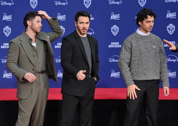 (L-R) Nick Jonas, Kevin Jonas and Joe Jonas of the Jonas Brothers participate in a hand and footprint ceremony immortalizing them in the forecourt of the TCL Chinese Theatre (formerly Grauman s) in the Hollywood section of Los Angeles on Wednesday, December 3, 2025.  LAP2025120316 JIMxRUYMEN