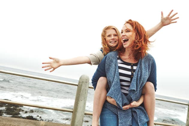 Ocean, piggyback and mother with girl, funny and nature with relationship, holiday and humor. Happy family, parent and mama carrying daughter, smile and bonding together with vacation, love and beach. model released property released Copyright: xx