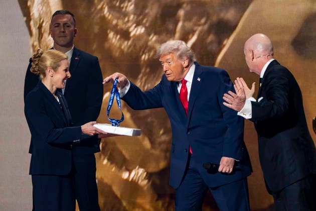 President Donal Trump receives a medal as part of the FIFA Peace Prize during the 2026 FIFA World Cup Draw at the John F. Kennedy Center for Performing Arts in Washington, DC on Friday, December 5, 2025. The draw will reveal the group-stage matchups for the first-ever 48-team FIFA World Cup in 2026.  WAP20251205336 BONNIExCASH