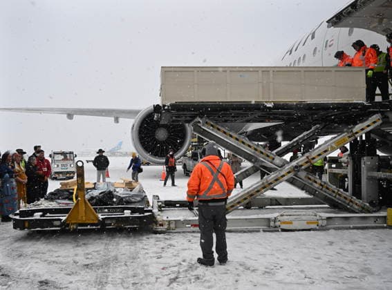 December 6, 2025, Montreal, Pq, Canada: Ground crew unload a kayak and other indigenous artifacts at Trudeau Airport in Montreal, Saturday, December 6, 2025, after they were returned by the Vatican. Montreal Canada  - ZUMAc35_ 20251206_zaf_c35_036 Copyright: xGrahamxHughesx