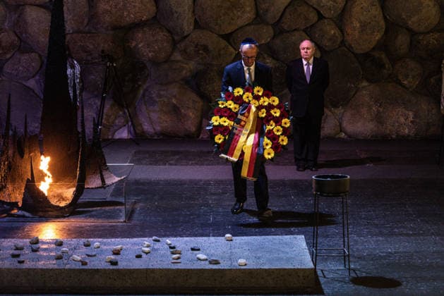 German Chancellor Friedrich Merz lays a wreath at the Hall of Remembrance during his visit to the Yad Vashem Holocaust Memorial Museum in Jerusalem, Israel, on Sunday, December 7, 2025. Pool  JERX2025120702 JOHNxWESSELS