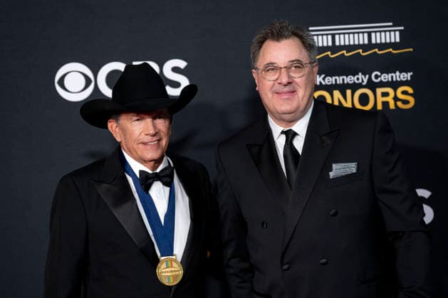 Kennedy Center Honoree George Straight and American singer-songwriter and musician Vince Gill arrive on the red carpet for the 48th annual Kennedy Center Honors at the Kennedy Center in Washington DC on Sunday, December 7, 2025. President Donald Trump will host this year s event, which honors songwriter George Strait, actors Michael Crawford and Sylvester Stallone, singer Gloria Gaynor, and the rock band Kiss.  WAP20251207535 BONNIExCASH
