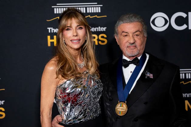 Kennedy Center Honoree Actor and Producer Sylvester Stallone and his wife, Jennifer Flavin Stallone, arrive on the red carpet for the 48th annual Kennedy Center Honors at the Kennedy Center in Washington DC on Sunday, December 7, 2025. President Donald Trump will host this year s event, which honors songwriter George Strait, actors Michael Crawford and Sylvester Stallone, singer Gloria Gaynor, and the rock band Kiss.  WAP20251207550 BONNIExCASH