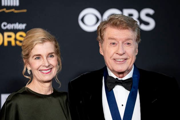 English actor and Kennedy Center Honoree Michael Crawford and Natasha MacAller arrive on the red carpet for the 48th annual Kennedy Center Honors at the Kennedy Center in Washington DC on Sunday, December 7, 2025. President Donald Trump will host this year s event, which honors songwriter George Strait, actors Michael Crawford and Sylvester Stallone, singer Gloria Gaynor, and the rock band Kiss.  WAP20251207525a BONNIExCASH