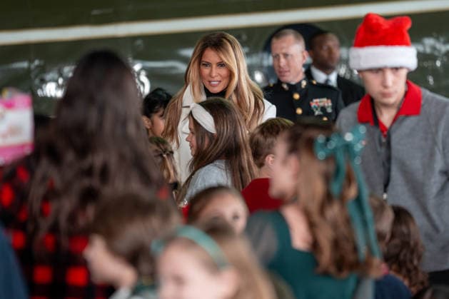 December 8, 2025, Quantico, Virginia, USA: First Lady MELANIA TRUMP walks into a crowd of children to help them sort toys at a Toys for Tots event at Marine Corps Base Quantico. Quantico USA - ZUMAs365 20251208_znp_s365_009 Copyright: xJoeyxSussmanx