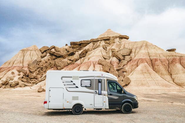Motorhome parked in the Bardenas Reales Natural Park, Navarra, Spain. Road trip and van life adventure through the arid desert landscape of northern Spain. Model Released SylviePm_ID32630_1111742_016 Copyright: xx RECORD DATE NOT STATED
