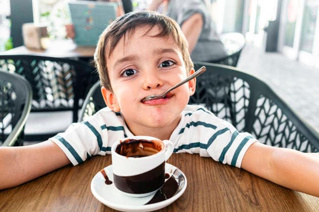 Adorable child enjoying a warm cup of hot chocolate Model Released SylviePm_ID32762_1115369_011 Copyright: xx RECORD DATE NOT STATED