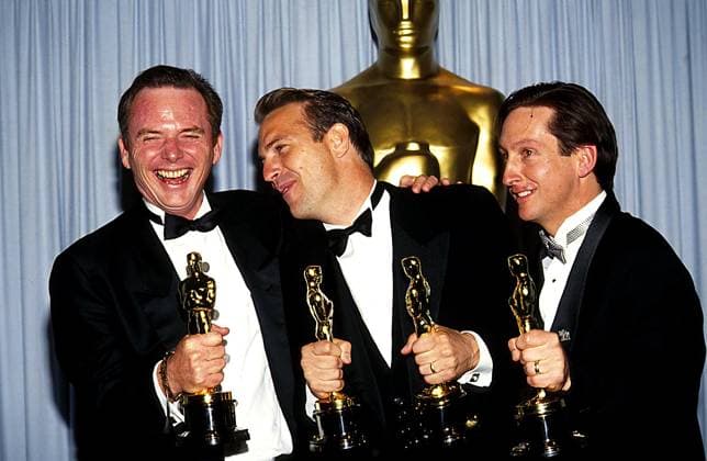 Michael Blake, Kevin Costner And Jim Wilson at The 63rd Academy Awards on March 25, 1991, at the Shrine Auditorium in Los Angeles, CA. Copyright: xRalphxDominguez MediaPunchx