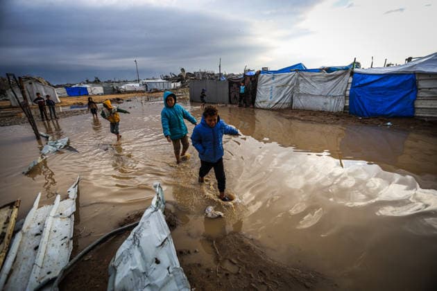 Heavy rain floods displaced Palestinians’ tents in Gaza GAZA CITY, GAZA - DECEMBER 11: Palestinians struggle with flooding after heavy rain hits the Abu Marhil Camp in the Az-Zaytun neighborhood in Gaza City, Gaza on December 11, 2025. Conditions for displaced residents whose homes were destroyed in Israeli attacks, worsening as they continue to struggle not only with the devastation of the conflict but also with the deteriorating weather conditions. Hamza Z. H. Qraiqea Anadolu Gaza City Gaza. Editorial use only. Please get in touch for any other usage.  Copyright: x2025xAnadoluxHamzaxZ.xH.xQraiqeax